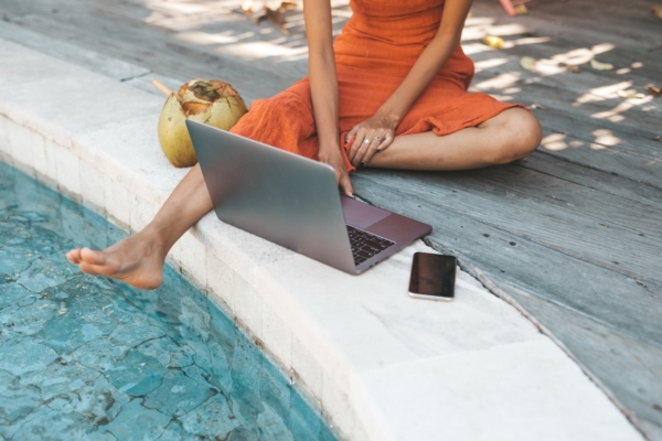 Image Of Woman By Pool With Laptop