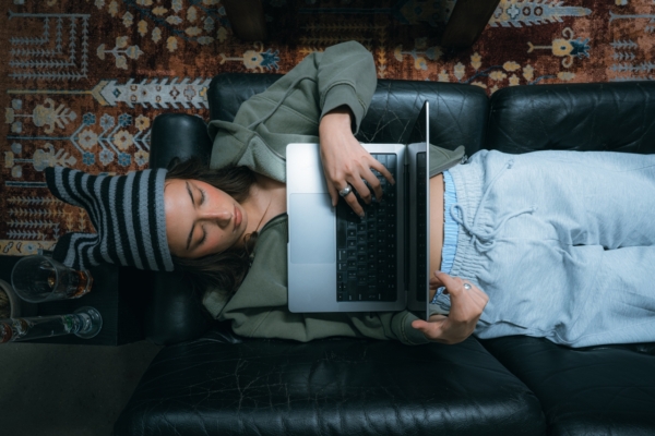 Image Of Woman Laying With Laptop On Couch